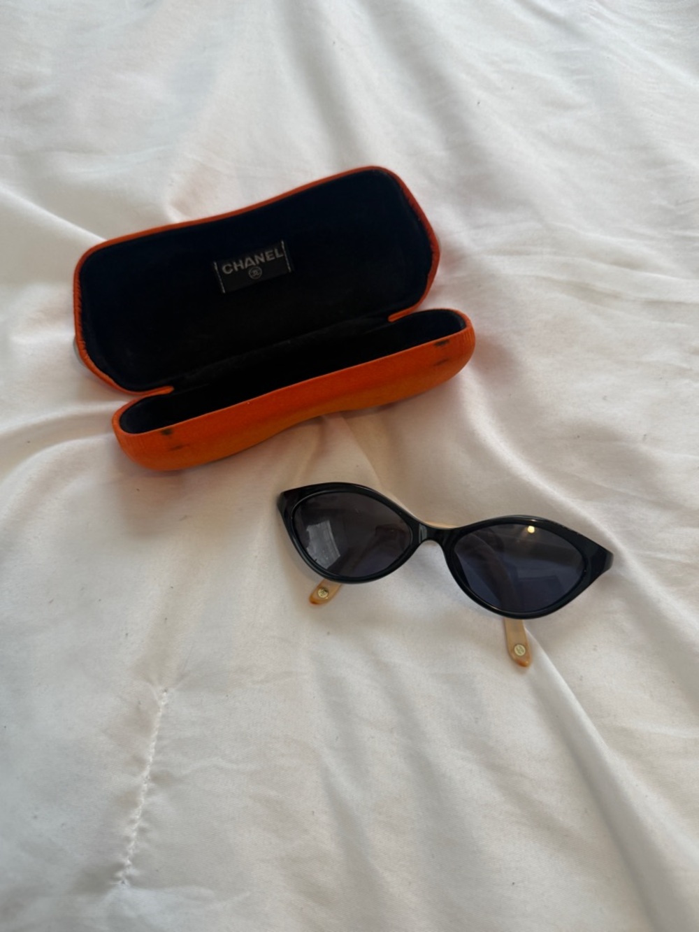 CHANEL Black Cat-Eye Sunglasses with Orange Case
